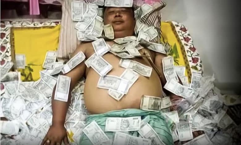 Assam Politician's Viral Photo on Bed of Notes Sparks Controversy, Party Distances Itself