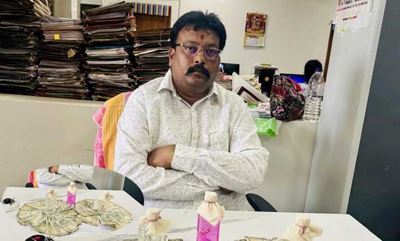 Telangana News | High-Stakes Corruption: Assistant Registrar Caught Red-Handed Accepting Bribe