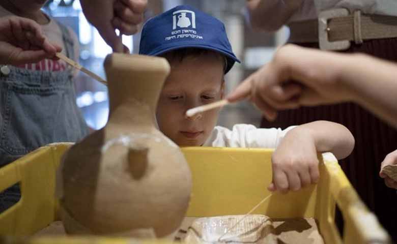 An Israeli boy who broke an ancient jar learns how the museum is piecing it back together