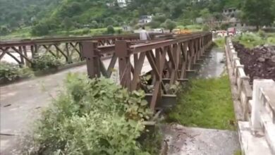 Bridge partially washed away by heavy rains