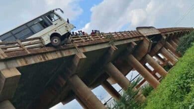 Driver Miraculously Escapes After Bus Crashes into Bridge Railing, Hangs Off Edge in Sangareddy