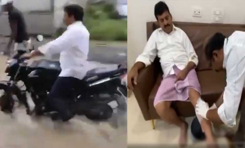 Minister Ponguleti Srinivas Reddy Falls While Riding Bike in Flooded Areas