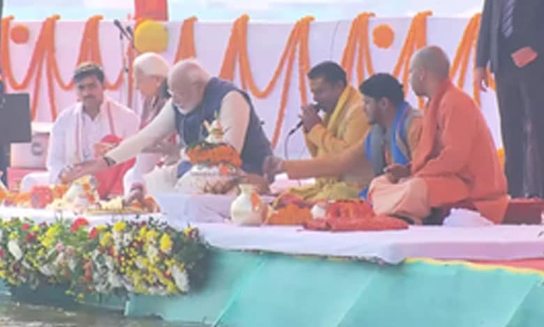 PM Modi in Prayagraj; meets saints, performs puja at Sangam