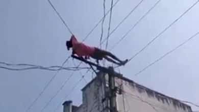 Drunk man climbs electric pole, lies down on wires in Andhra Pradesh